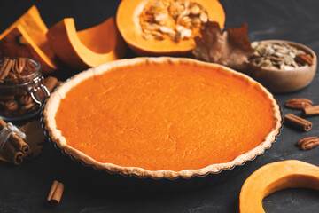 Delicious homemade pumpkin pie on black table