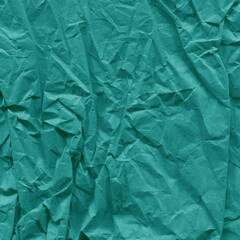 Blue vintage and old looking crumpled paper background. Retro cardboard texture. Grunge paper for drawing. Ancient book page. Present wrapping.