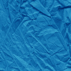 Obraz premium Blue vintage and old looking crumpled paper background. Retro cardboard texture. Grunge paper for drawing. Ancient book page. Present wrapping.