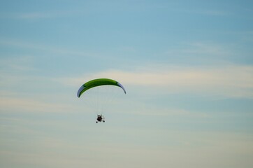 Paraglider flying free in the sky