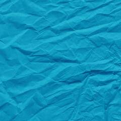 Fototapeta premium Blue vintage and old looking crumpled paper background. Retro cardboard texture. Grunge paper for drawing. Ancient book page. Present wrapping.