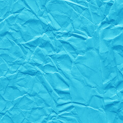 Blue vintage and old looking crumpled paper background. Retro cardboard texture. Grunge paper for drawing. Ancient book page. Present wrapping.