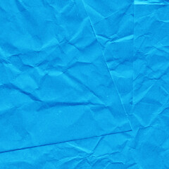 Blue vintage and old looking crumpled paper background. Retro cardboard texture. Grunge paper for drawing. Ancient book page. Present wrapping.