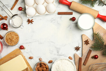Fototapeta na wymiar Flat lay composition with ingredients for traditional Christmas cake on white marble table. Space for text