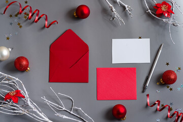 New Year card with letters and red holiday decoration.