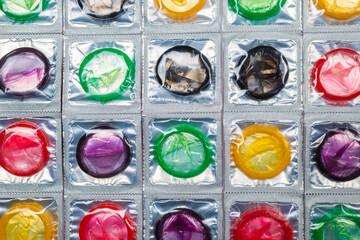 Colorful condoms background.
