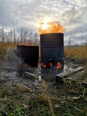 Fire in an old barrel on the street.