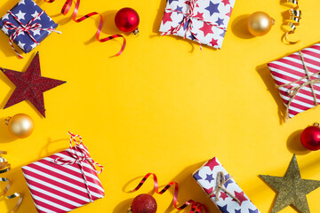 Fototapeta premium Holiday frame from Christmas gift boxes and decoration.