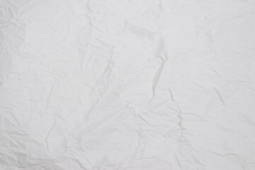 Crumpled white paper background.