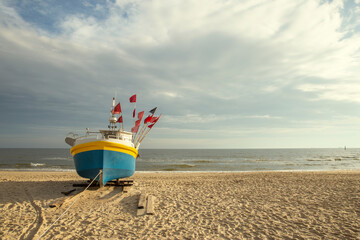 Fishing boat on the beach at Baltic sea, Poland - obrazy, fototapety, plakaty