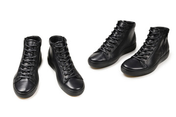 Men's black leather shoes and a black camera on a isolated on white background. Copy space.