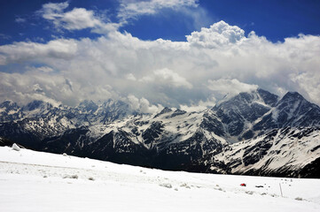 Fototapeta na wymiar View from the slope of Elbrus to the Main Caucasian ridge.