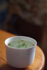 thyme herbal tea in a white cup