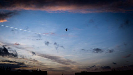 helicopter on sunset background. - obrazy, fototapety, plakaty