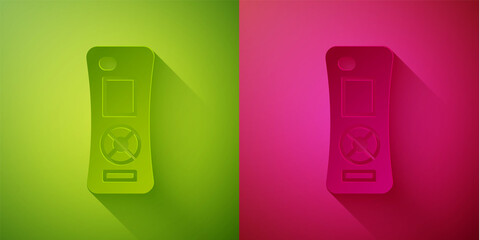 Paper cut Remote control icon isolated on green and pink background. Paper art style. Vector.