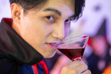 young Asian woman wearing costume in Halloween festival party