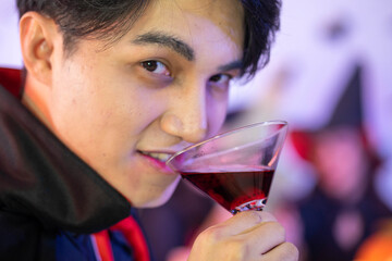 young Asian woman wearing costume in Halloween festival party