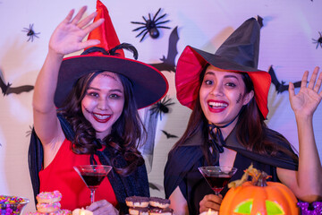 young Asian woman wearing costume in Halloween festival party