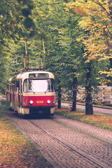 old red tram in autumn Prague