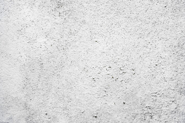 Texture of a concrete wall with cracks and scratches which can be used as a background