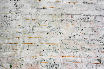 Texture of a brick wall with cracks and scratches which can be used as a background