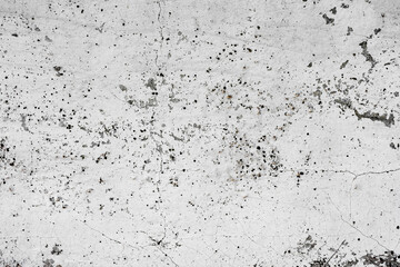Texture of a concrete wall with cracks and scratches which can be used as a background