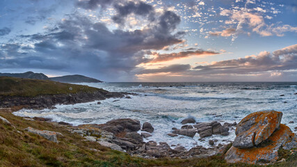 Fototapeta na wymiar Sunset in the cliffs of the fishing village of Muxía, Costa da Morte, Galicia, Spain. 