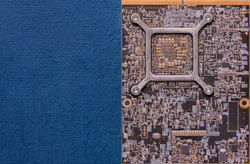 Electronic circuit board on blue background with copy space, top