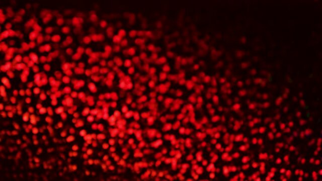 Red Sequins texture background. 4k resolution video. Beautiful shiny red background of shiny sequins.