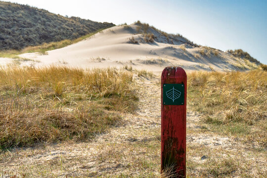 A hiking trail marker to the north sea beach in Denmark