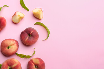 Fresh donut peaches on light pink background, flat lay. Space for text