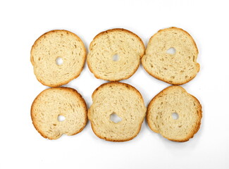 Round bread slices. Bake rolls. Mini bread chips isolated on white background. Round bread slices.