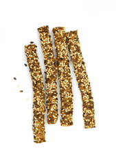 Stick crackers. Sesame- linen stick crackers. Pretzel bread stick with sesame and linen, flax seeds isolated on white background.