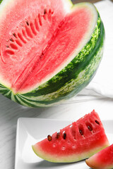 Yummy cut watermelon slices on white table