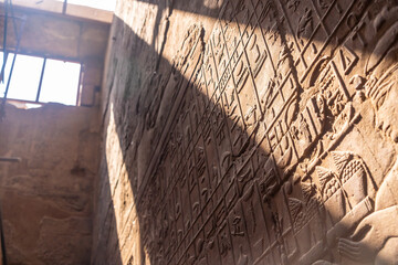 Detail of beautiful natural light on an ancient egyptian drawings inside the Luxor Temple, Egypt