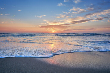 Sunset on the beach of Mar de Fora, Finisterre, Galicia, Spain. This beach is the westernmost beach in Europe, so people go there to see one of the most impressive sunsets in Northern Spain