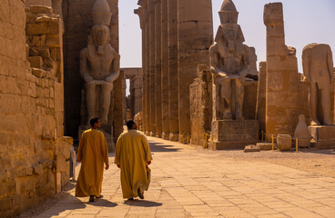 Luxor, Egypt '; October 11, 2020: Two local men visiting the Egyptian Temple of Luxor and its...