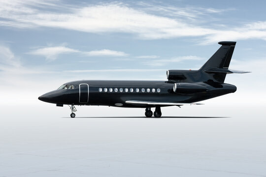 Modern Black Corporate Business Jet Isolated On Light Background With Sky