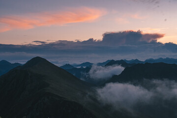 A sunrise on a cloudy landscape with mountains, Monte Fravort, Lagorai, Trentino, Italy