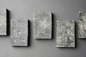 Natural tar soap on black table, flat lay
