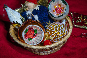 The Basket with Old Christmas baubles. Selective focus.