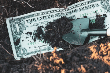 bury the dollar by burying and throwing earth