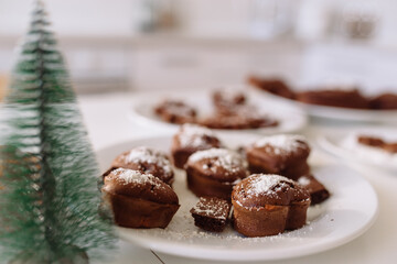 Fresh homemade chocolate chip cookies in coconut and sugar crumbs on a white plate.