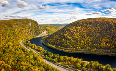 Aerial view of Delaware Water Gap on a sunny autumn day with forward camera motion. The Delaware Water Gap is a water gap on the border of the U.S. states of New Jersey and Pennsylvania