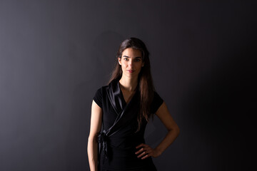 A smiling young woman standing in the studio