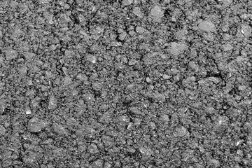 Surface grunge rough of asphalt, Seamless tarmac dark grey grainy road, Texture Background. Fresh new Smooth asphalt road. The texture of the tarmac. Abstract background. Monochrome texture.
