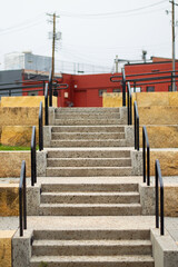 cement staircase with black railing
