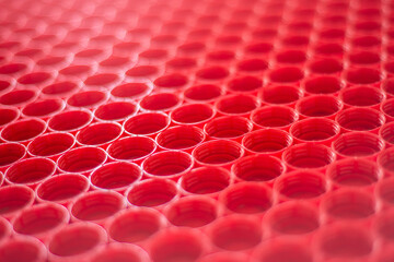 recycling plastic concept. red abstract background of plastic caps from a bottle, top view, short...