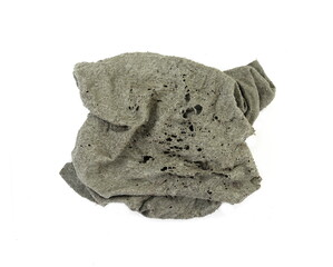 Old dirty torn rag isolated on white background. Cleaning rag.