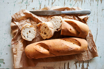 Whole and sliced bread / loaf, gluten-free, on a light background. Gluten free.